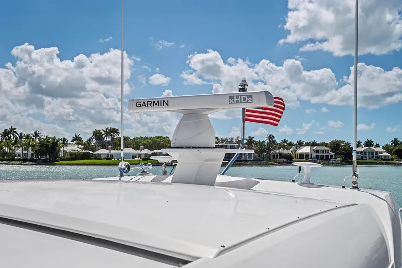 Southwind Yacht Photos Pics 2018 Tiara Yachts C44 Coupe with Garmin radar, American flag, and scenic waterfront view.