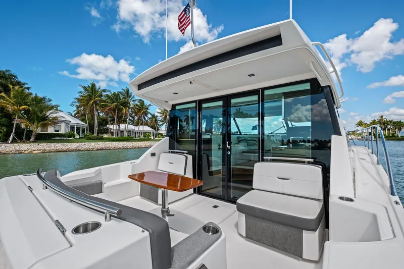 Southwind Yacht Photos Pics 2018 Tiara Yachts C44 Coupe on water, featuring sleek design and luxurious seating.