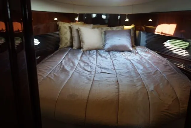 L' Aventura Yacht Photos Pics Luxurious bedroom interior of 2010 Sea Ray 470 Sundancer yacht.