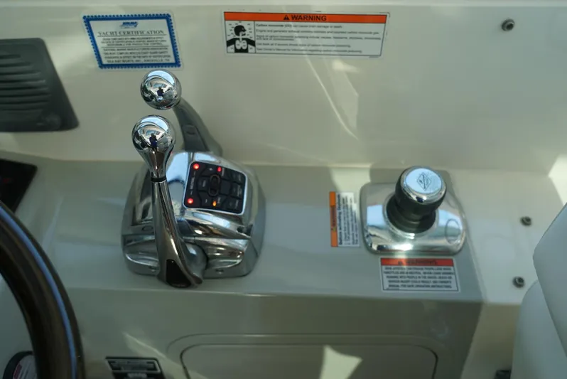 L' Aventura Yacht Photos Pics Sea Ray 470 Sundancer 2010 helm controls with throttle and joystick.