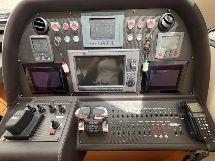  Yacht Photos Pics Control panel of a 2011 Pershing 64 yacht with navigation and communication equipment.