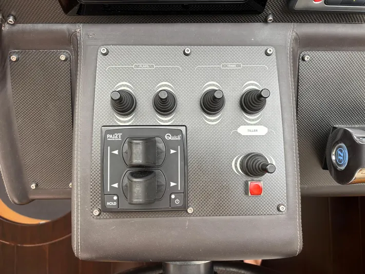  Yacht Photos Pics Control panel of a 2011 Pershing 64 yacht with joystick and button controls.