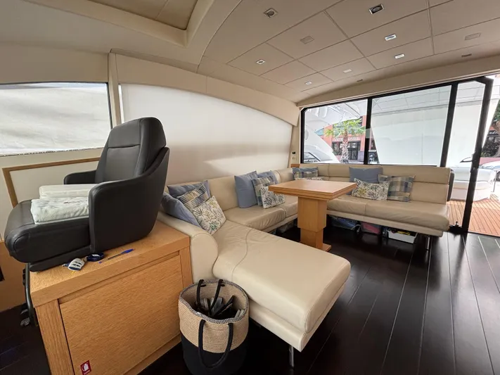  Yacht Photos Pics Luxurious interior of a 2011 Pershing 64 yacht with leather seating and modern decor.