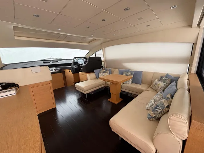  Yacht Photos Pics Luxurious interior of 2011 Pershing 64 yacht with elegant seating and modern helm.