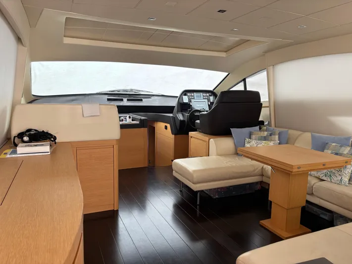  Yacht Photos Pics Luxurious interior of a 2011 Pershing 64 yacht with modern helm and seating area.
