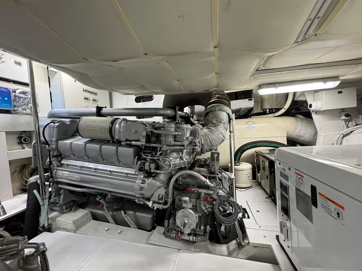  Yacht Photos Pics Engine room of a 2011 Pershing 64 yacht, showcasing machinery and equipment.