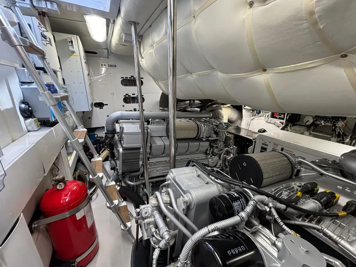  Yacht Photos Pics Engine room of a 2011 Pershing 64 yacht, featuring complex machinery and equipment.