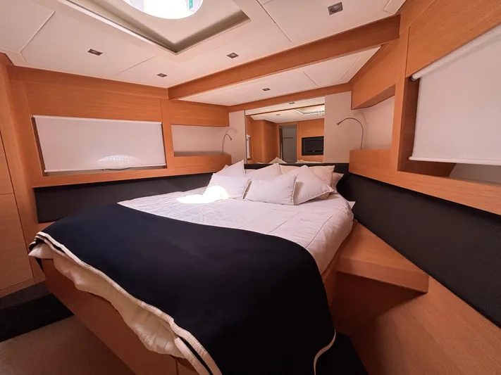  Yacht Photos Pics Luxurious bedroom interior of 2011 Pershing 64 yacht with modern design and cozy bedding.