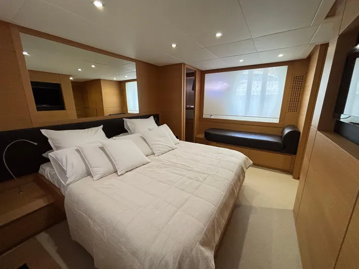  Yacht Photos Pics Luxurious bedroom interior of 2011 Pershing 64 yacht with modern design and cozy bedding.