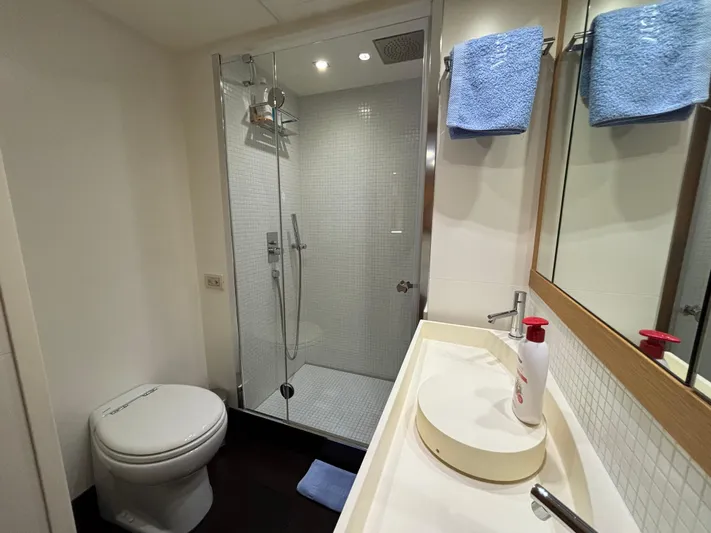  Yacht Photos Pics Bathroom interior of 2011 Pershing 64 yacht with shower, sink, and toilet.
