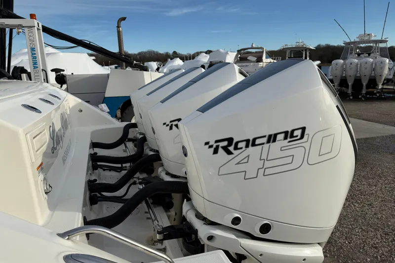 Siper Brokerage Yacht Photos Pics 2021 Boston Whaler 380 Realm with powerful Racing 450 engines docked at a marina.