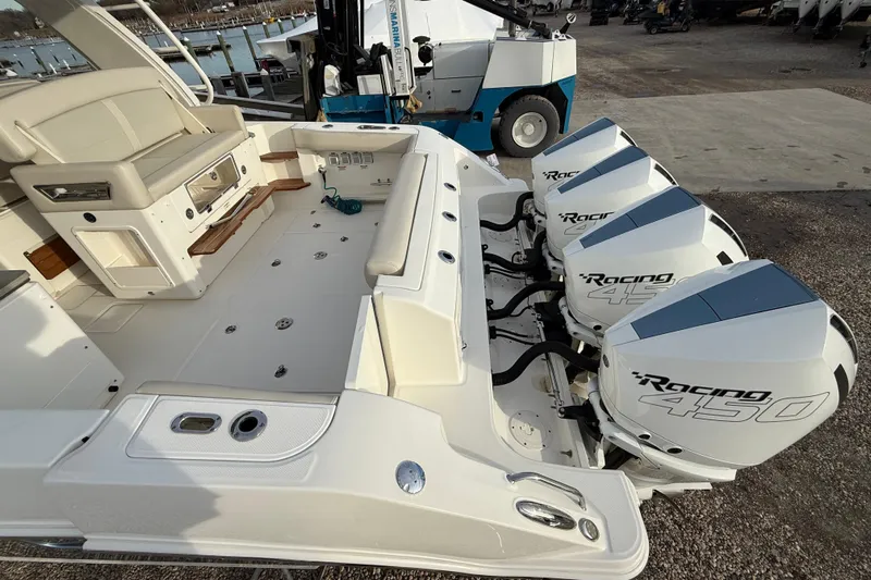 Siper Brokerage Yacht Photos Pics 2021 Boston Whaler 380 Realm with triple Racing 450 engines, docked at marina.