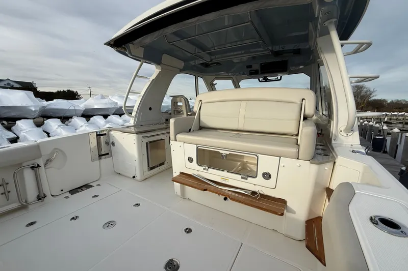 Siper Brokerage Yacht Photos Pics 2021 Boston Whaler 380 Realm boat interior with seating and storage.