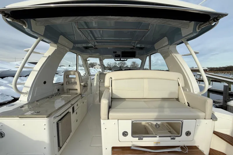 Siper Brokerage Yacht Photos Pics 2021 Boston Whaler 380 Realm interior with seating and storage, showcasing luxury and functionality.