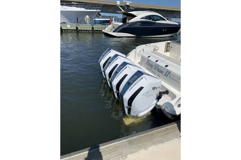 Siper Brokerage Yacht Photos Pics 2021 Boston Whaler 380 Realm with quad outboard engines docked at marina.