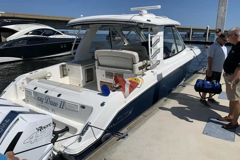 Siper Brokerage Yacht Photos Pics 2021 Boston Whaler 380 Realm docked, featuring sleek design and powerful engines.