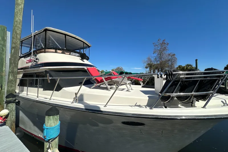 Anchored Souls Yacht Photos Pics 1988 Californian 45 Motor Yacht docked, featuring spacious deck and sleek design.