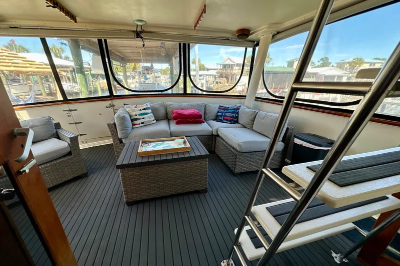 Anchored Souls Yacht Photos Pics 1988 Californian 45 Motor Yacht interior with cozy seating and nautical decor.