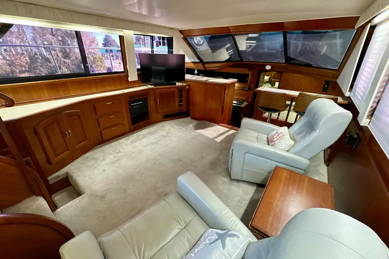 Anchored Souls Yacht Photos Pics Luxurious interior of 1988 Californian 45 Motor Yacht with plush seating and elegant wood finishes.