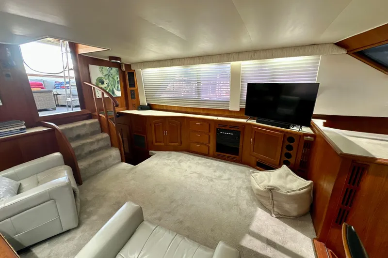 Anchored Souls Yacht Photos Pics Interior of 1988 Californian 45 Motor Yacht with modern furnishings and entertainment setup.