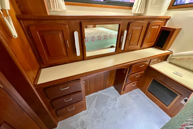 Anchored Souls Yacht Photos Pics 1988 Californian 45 Motor Yacht interior with wooden cabinetry and mirror.