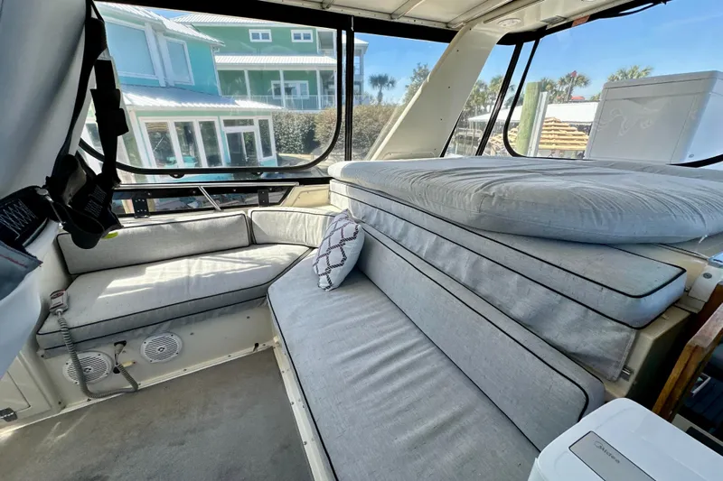 Anchored Souls Yacht Photos Pics 1988 Californian 45 Motor Yacht interior with gray seating and large windows.
