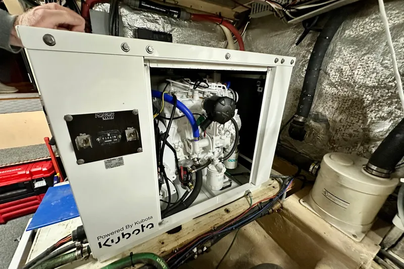 Anchored Souls Yacht Photos Pics Engine room of 1988 Californian 45 Motor Yacht with Kubota generator.