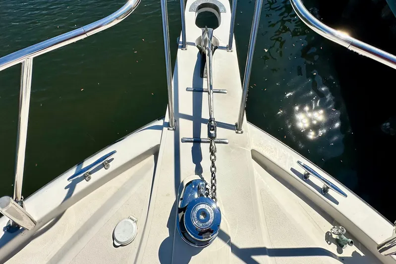 Anchored Souls Yacht Photos Pics Bow of 1988 Californian 45 Motor Yacht with anchor chain and railing.