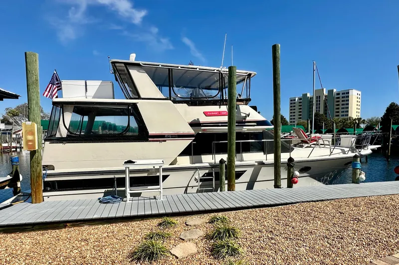 Anchored Souls Yacht Photos Pics 1988 Californian 45 Motor Yacht docked at marina with clear blue sky.