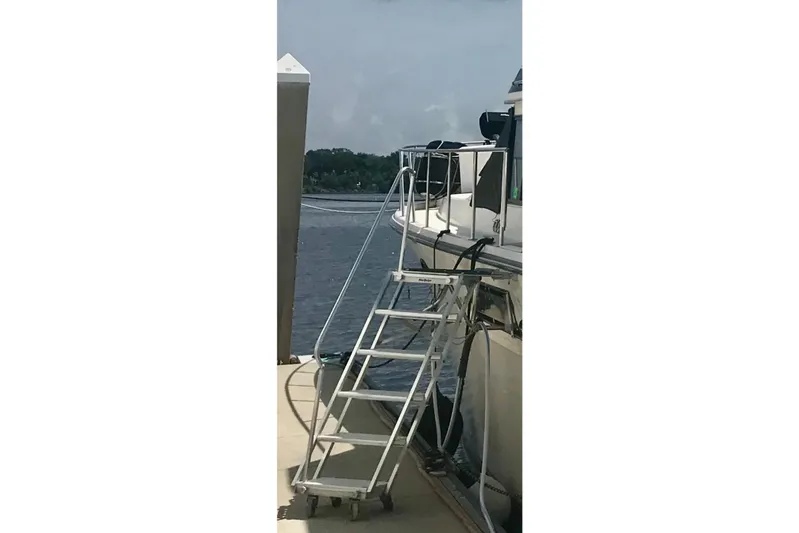 Anchored Souls Yacht Photos Pics 1988 Californian 45 Motor Yacht docked with boarding ladder.