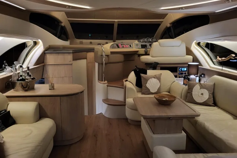 11:11 Yacht Photos Pics Luxurious interior of a 2006 Azimut Fly 50 yacht with elegant seating and modern amenities.