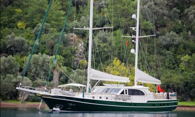  Yacht Photos Pics Sailing yacht Evadne 37mt, 2008 model, anchored near lush green forest.
