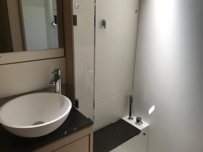  Yacht Photos Pics Modern bathroom interior on 2020 Jeanneau 54 yacht with sleek sink and shower.