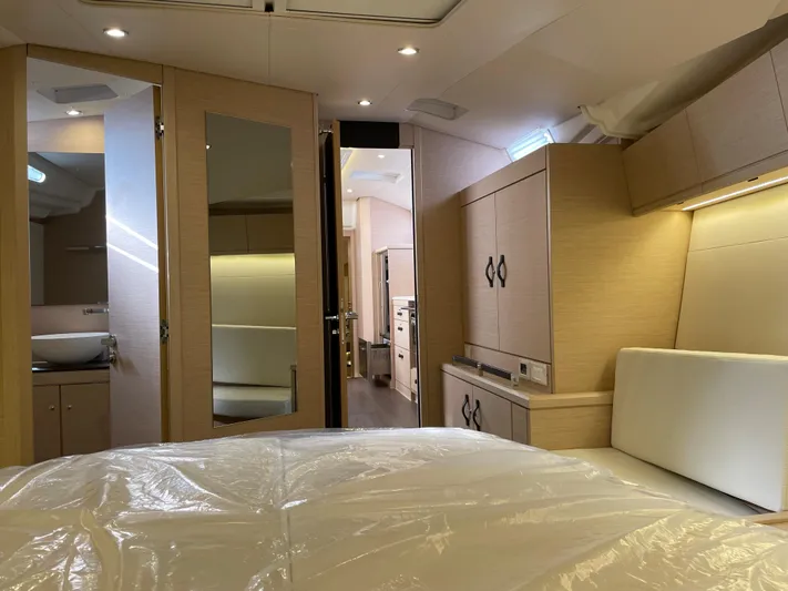  Yacht Photos Pics Luxurious interior of 2020 Jeanneau 54 yacht with modern furnishings and ambient lighting.
