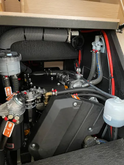  Yacht Photos Pics Engine compartment of a 2020 Jeanneau 54 yacht, showcasing mechanical components and wiring.