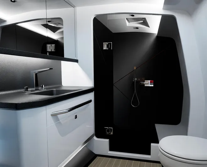  Yacht Photos Pics Modern bathroom in 2024 Infiniti 60 Powercat Coupe with sleek black and white design.