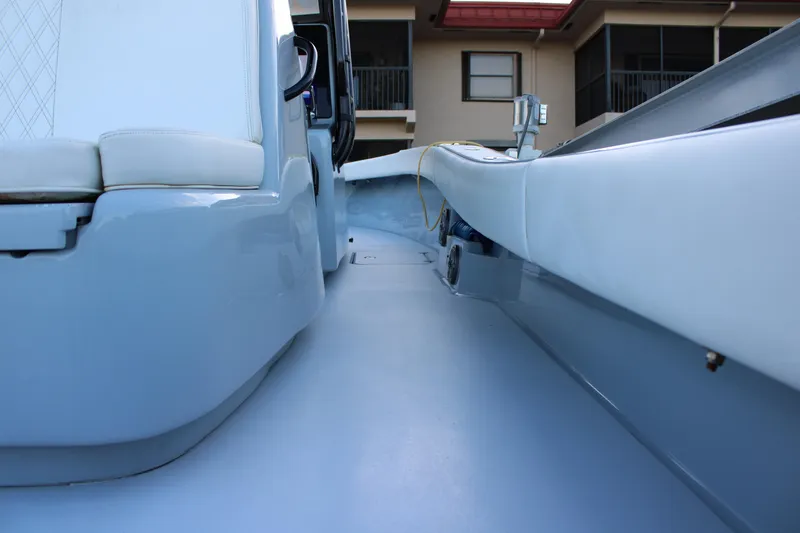  Yacht Photos Pics Interior view of a 2019 Conch 33 boat, showcasing sleek seating and modern design.