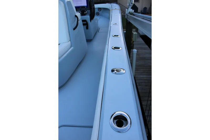  Yacht Photos Pics 2019 Conch 33 boat interior with rod holders along the side.