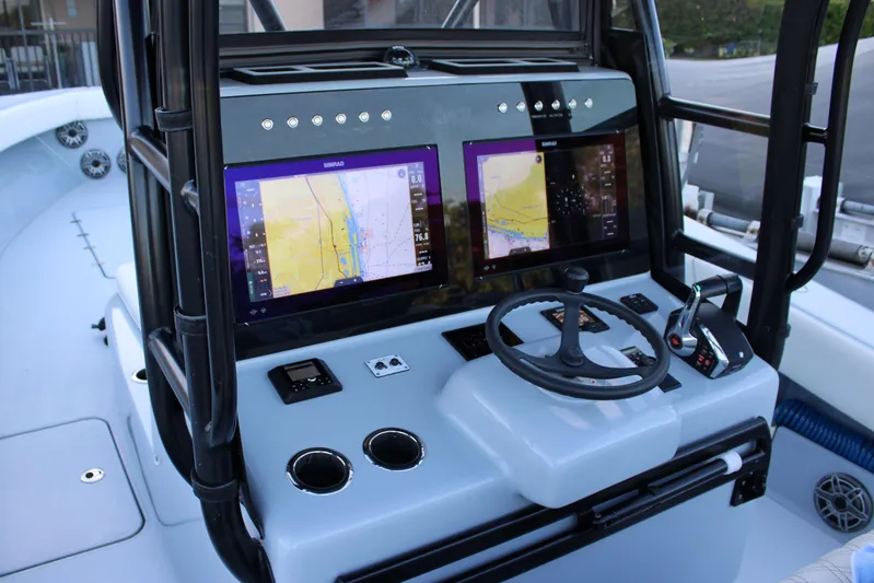  Yacht Photos Pics Cockpit of 2019 Conch 33 boat with dual navigation screens and steering wheel.