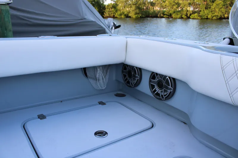  Yacht Photos Pics Interior of 2019 Conch 33 boat with speakers and storage compartment.
