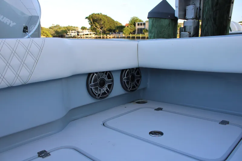  Yacht Photos Pics Interior of 2019 Conch 33 boat with speakers and cushioned seating.