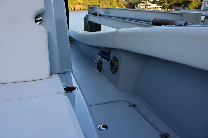 Yacht Photos Pics 2019 Conch 33 boat interior with white seating and cup holders.