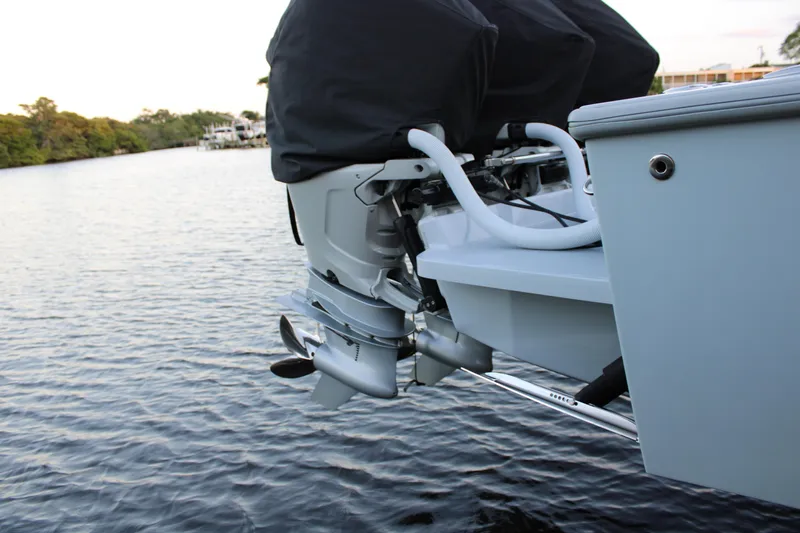  Yacht Photos Pics 2019 Conch 33 boat engine detail on calm water.