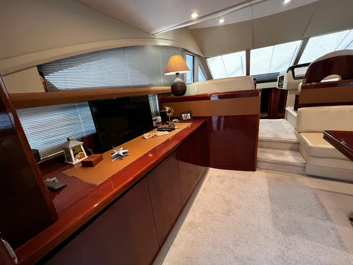  Yacht Photos Pics Luxurious interior of a 2008 Princess 50 yacht with elegant wood finishes.