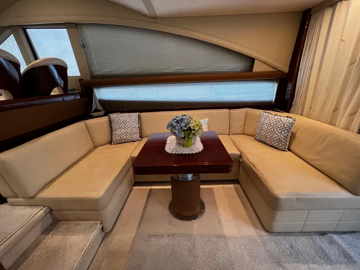  Yacht Photos Pics Luxurious interior of a 2008 Princess 50 yacht with beige seating and elegant decor.