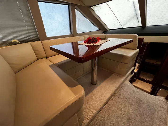  Yacht Photos Pics Luxurious interior of a 2008 Princess 50 yacht with elegant seating and table.