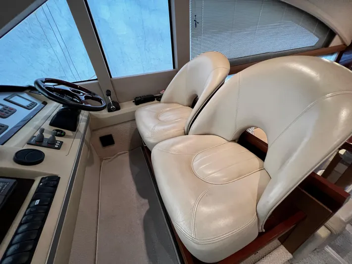  Yacht Photos Pics Luxurious helm seats in a 2008 Princess 50 yacht cockpit.