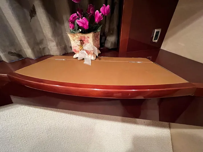  Yacht Photos Pics Elegant wooden desk with floral arrangement on a Princess 50 yacht, 2008 model.