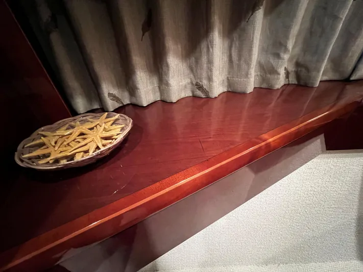  Yacht Photos Pics Plate of snacks on wooden surface inside a 2008 Princess 50 yacht.