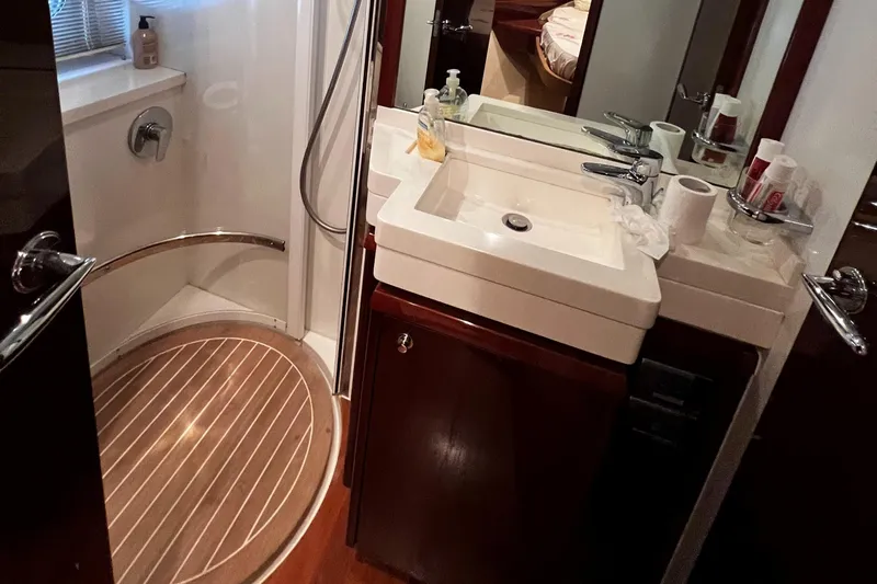  Yacht Photos Pics Luxurious bathroom in 2008 Princess 50 yacht with shower and sink.